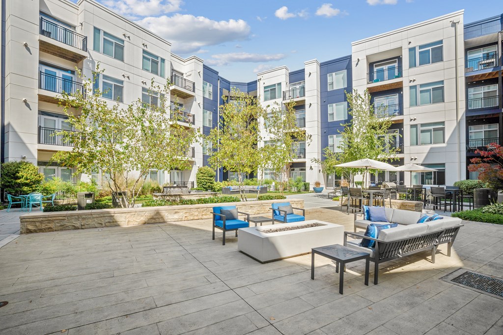 an outdoor patio with a firepit and seating area at Indigo 301 Apartments, Pennsylvania, 19406