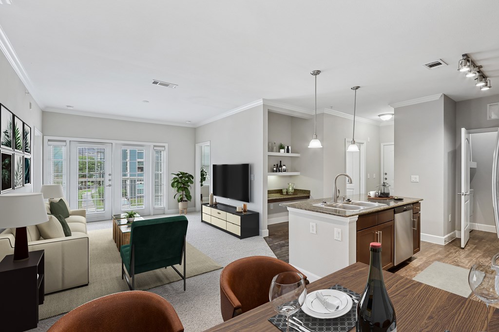 A modern living room with a dining table set for two.