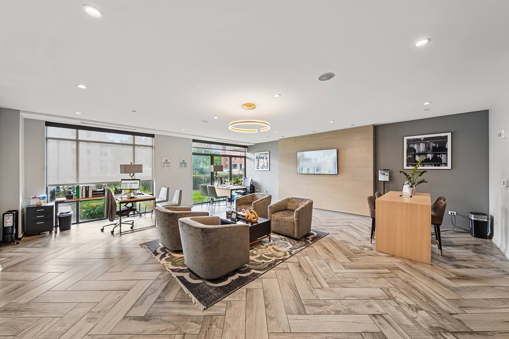 A spacious office with wooden floors and modern furniture.