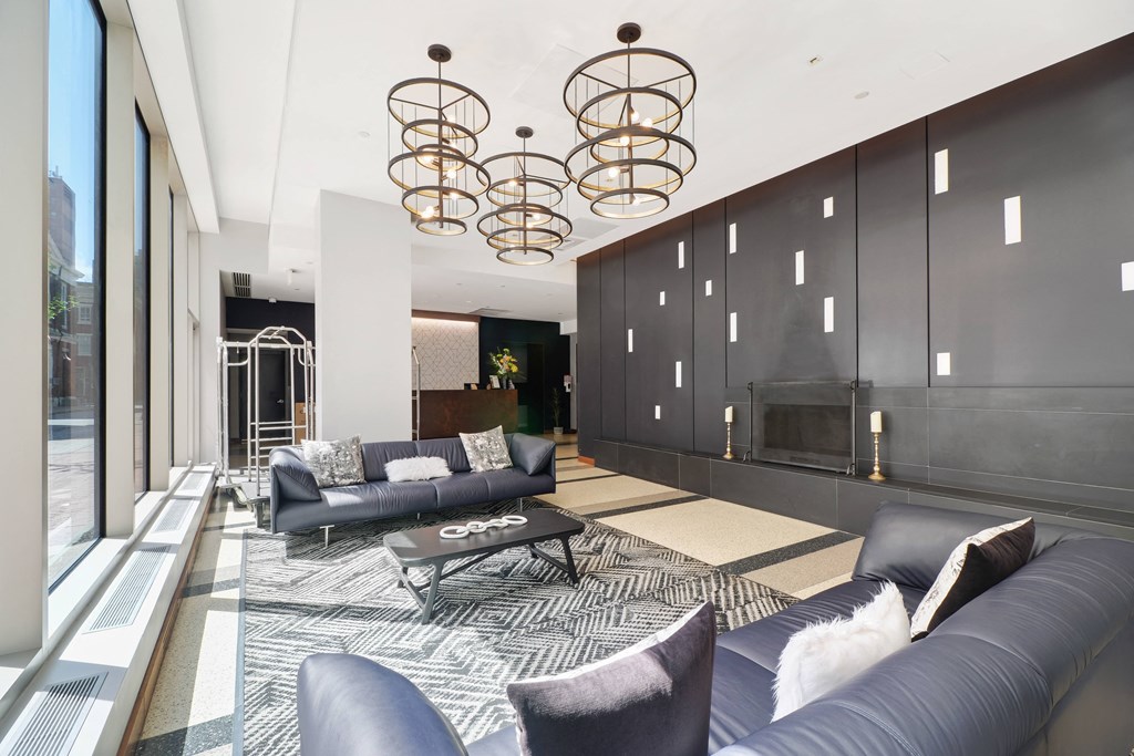 a living room filled with furniture and a large window