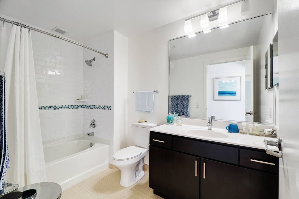 a bathroom with a toilet sink and bathtub