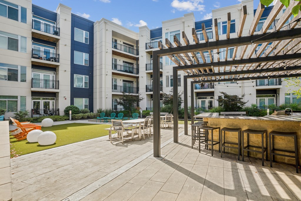 an outdoor patio with tables and chairs at Indigo 301 Apartments, Pennsylvania, 19406