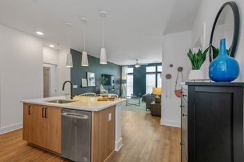 a kitchen and living room in a 555 waverly unit
