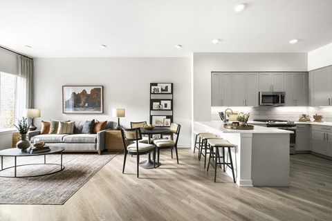 a living room with a kitchen and a dining room at The Ivy, Chatham New Jersey