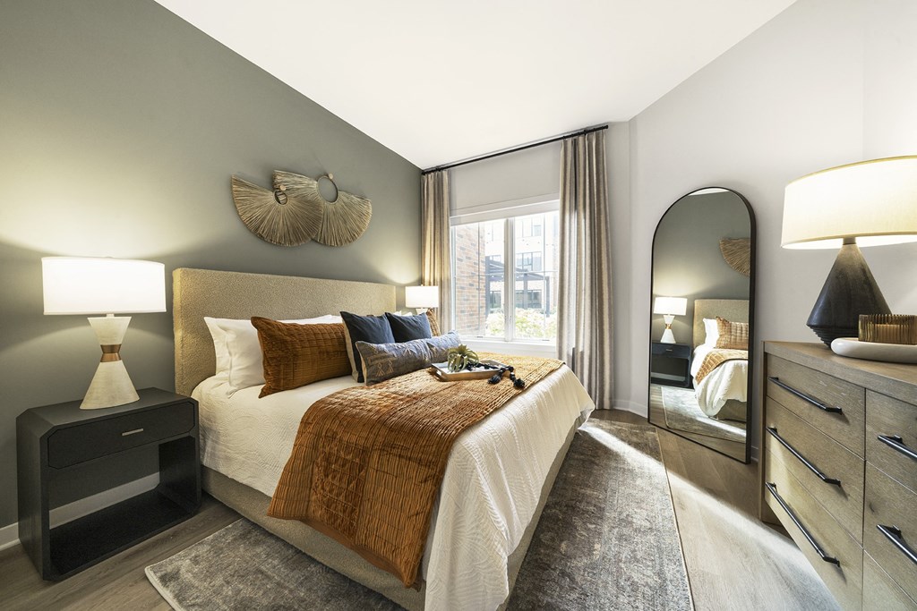 a bedroom with a large bed and a large window at The Ivy, Chatham