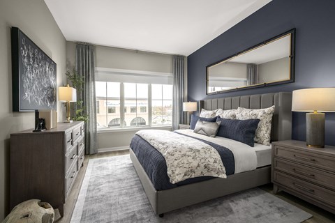 a bedroom with a bed and a window at The Ivy, Chatham