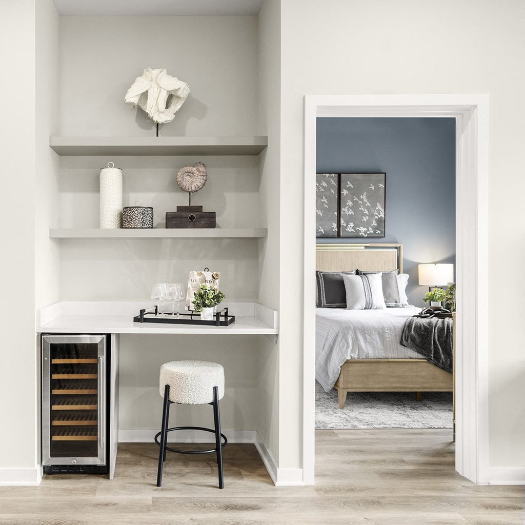 a bedroom with a bed and a desk with a stool at The Ivy, Chatham, NJ