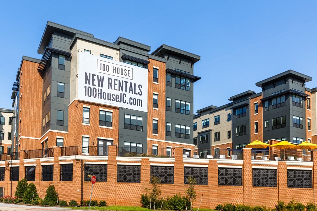 a building with a sign that reads 100 house new rentals at 100 House Apartments, New Jersey, 07310