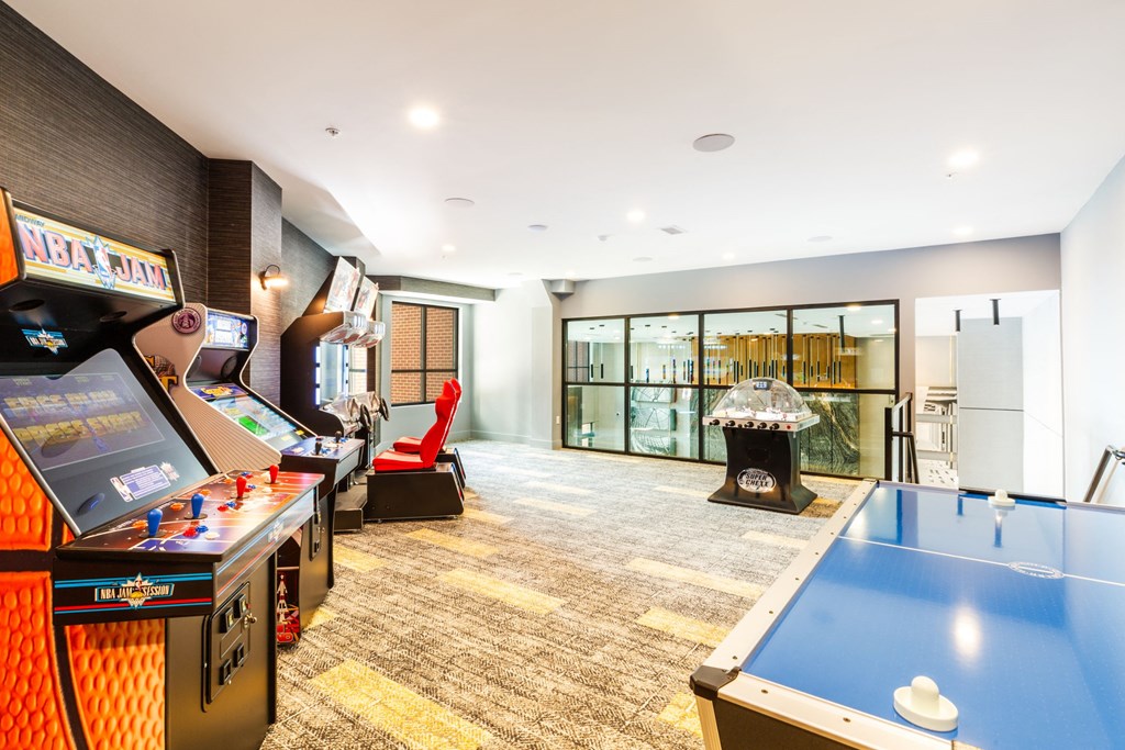 a games room with a pool table and a fireplace at 100 House Apartments, Jersey City , 07310
