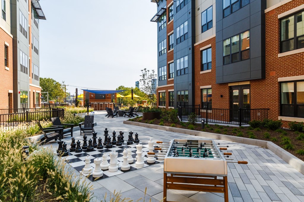 a chess board in the middle of an apartment courtyard at 100 House Apartments, Jersey City , 07310
