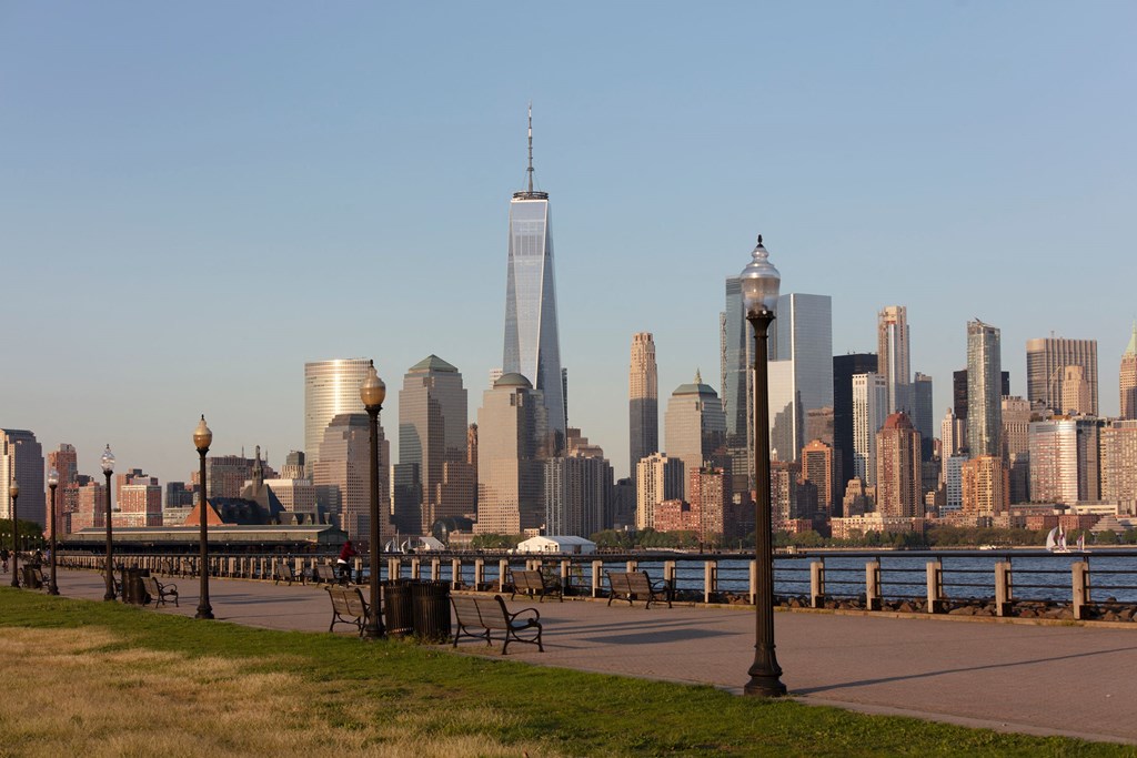 a view of the skyline and the hudson river from a park at 100 House Apartments, Jersey City , NJ, 07310