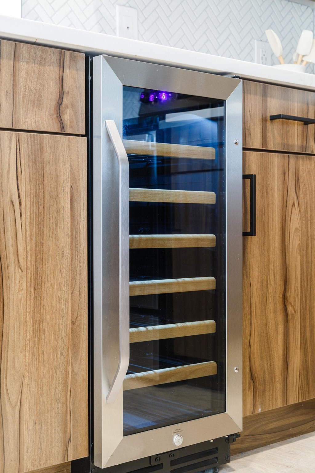 a stainless steel oven with a glass door in a kitchen