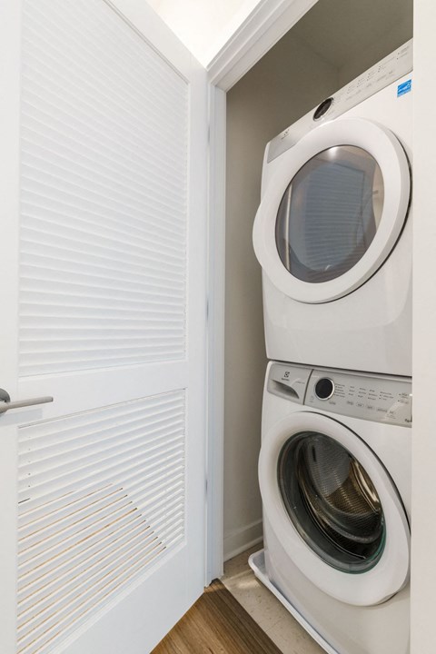 a washer and dryer in a small laundry room at One Ten Apartments, Jersey City , NJ, 07310