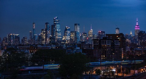 a view of the city skyline at night at One Ten Apartments, New Jersey, 07310