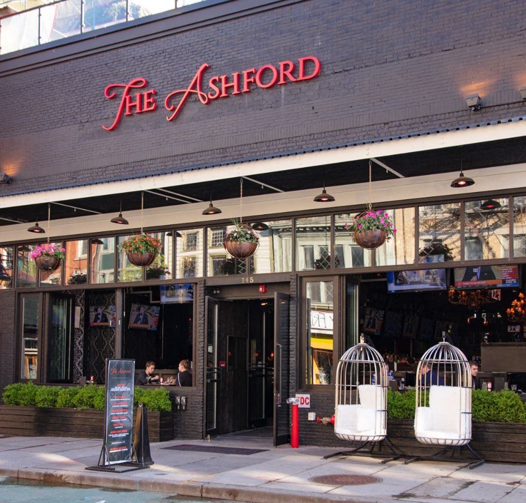 the outside of the ashford restaurant in the city