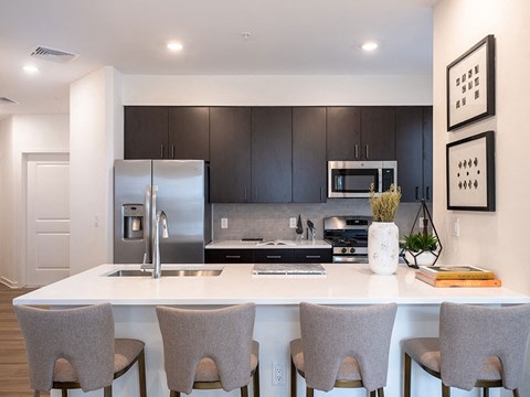 a kitchen with a counter top and a refrigerator