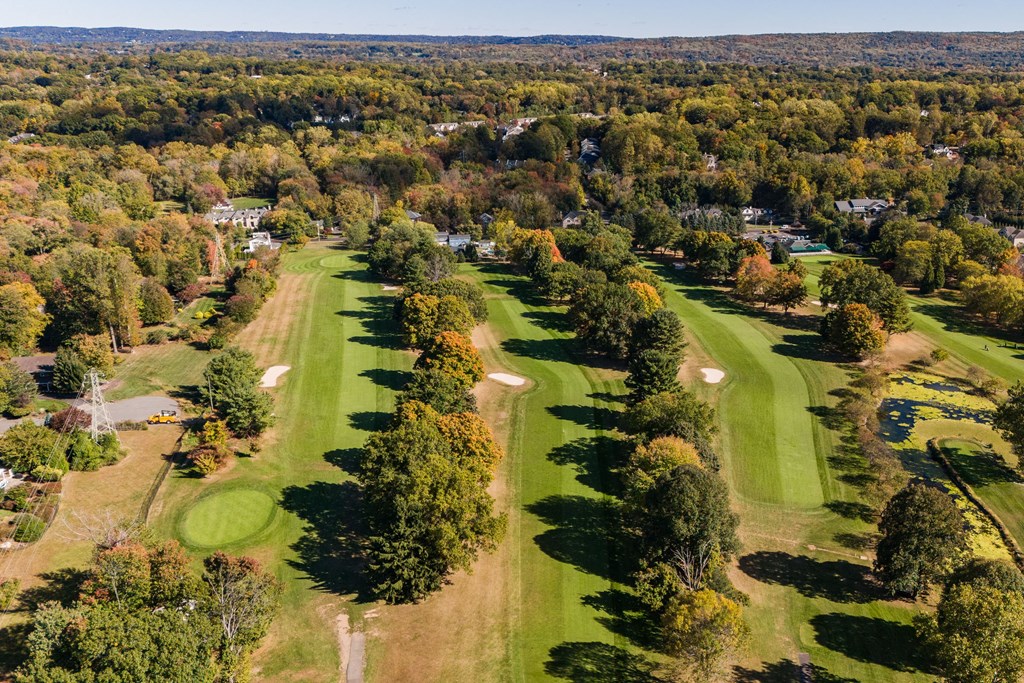 A golf course surrounded by trees in autumn at The Reserve at Pearl River Apartments, Pearl River, 10965
