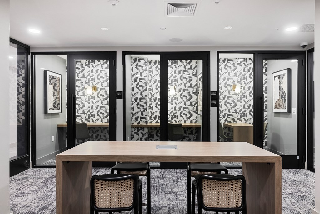 a conference room with a table and chairs