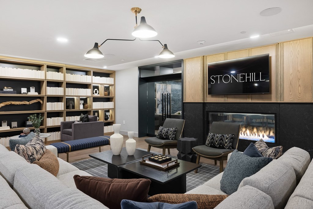 a living room filled with furniture and a fireplace