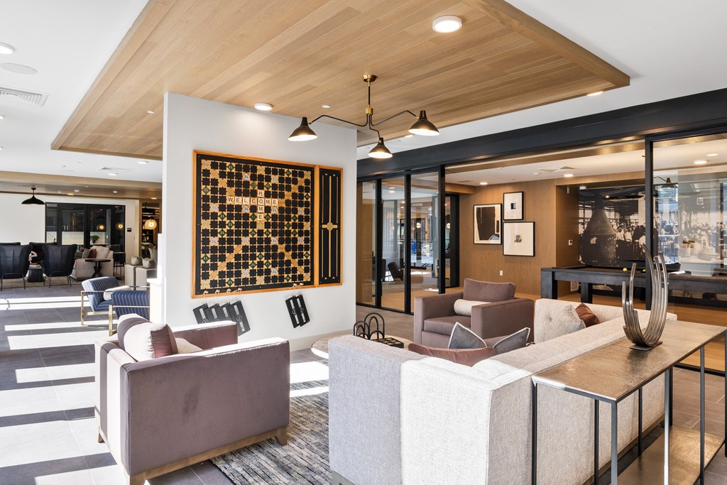 a living room with couches and chairs and a table