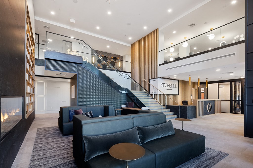 a large lobby with couches and a staircase