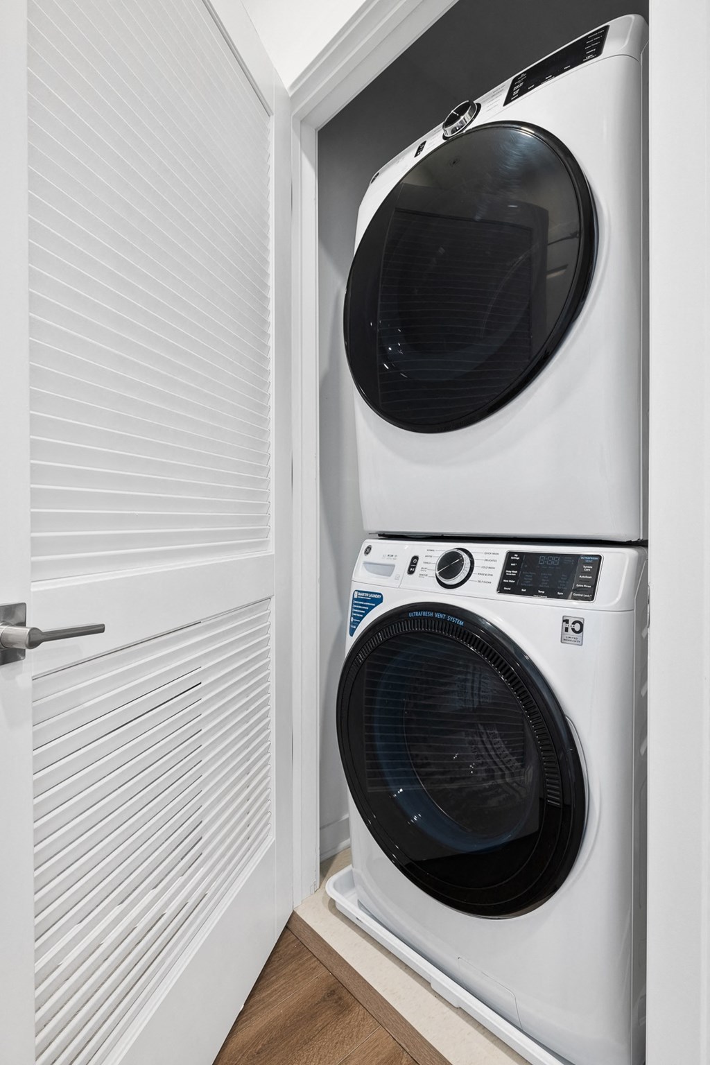 a white washer and dryer in a laundry room