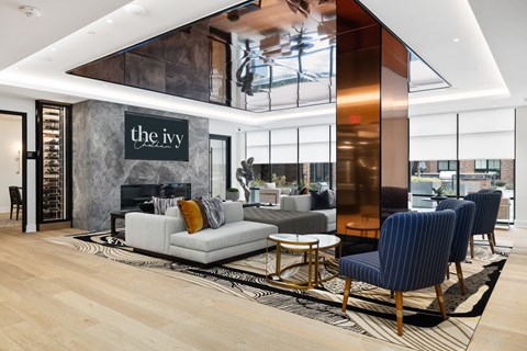 a living room with a couch and chairs and a fireplace at The Ivy, Chatham New Jersey