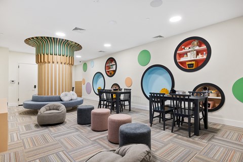 a living room with tables and chairs and a pillar at The Ivy, New Jersey, 07928