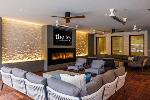 a living room with couches and chairs and a fireplace at The Ivy, Chatham
