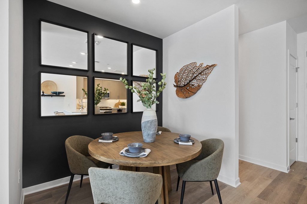 A dining room with a round table and chairs at The Reserve at Pearl River Apartments, Pearl River, NY, 10965