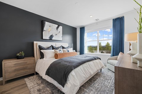 A bedroom with a large bed, a nightstand, and a chair. A bedroom with a large bed, a nightstand, and a chair at The Reserve at Pearl River Apartments, Pearl River, 10965