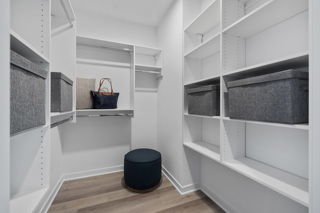 A room with white shelves and a black bag on one of them at The Reserve at Pearl River Apartments, Pearl River