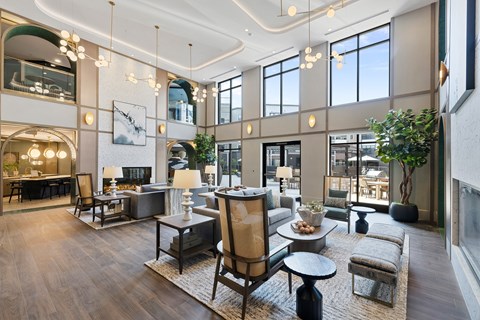 A modern living room with a large sofa set and a coffee table.