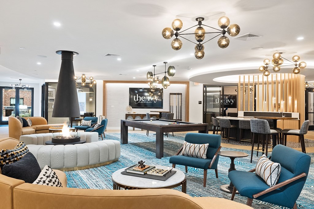 a living room with couches and chairs and a table with a billiards at The Ivy, Chatham, NJ 07928