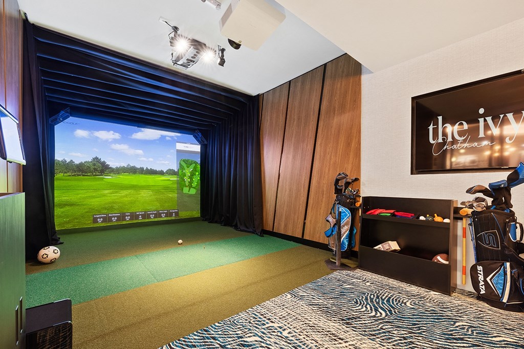 a living room with a tv and a view of the golf course at The Ivy, New Jersey