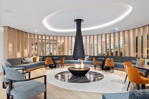 a lobby with couches and chairs and a fire pit at The Ivy, Chatham New Jersey