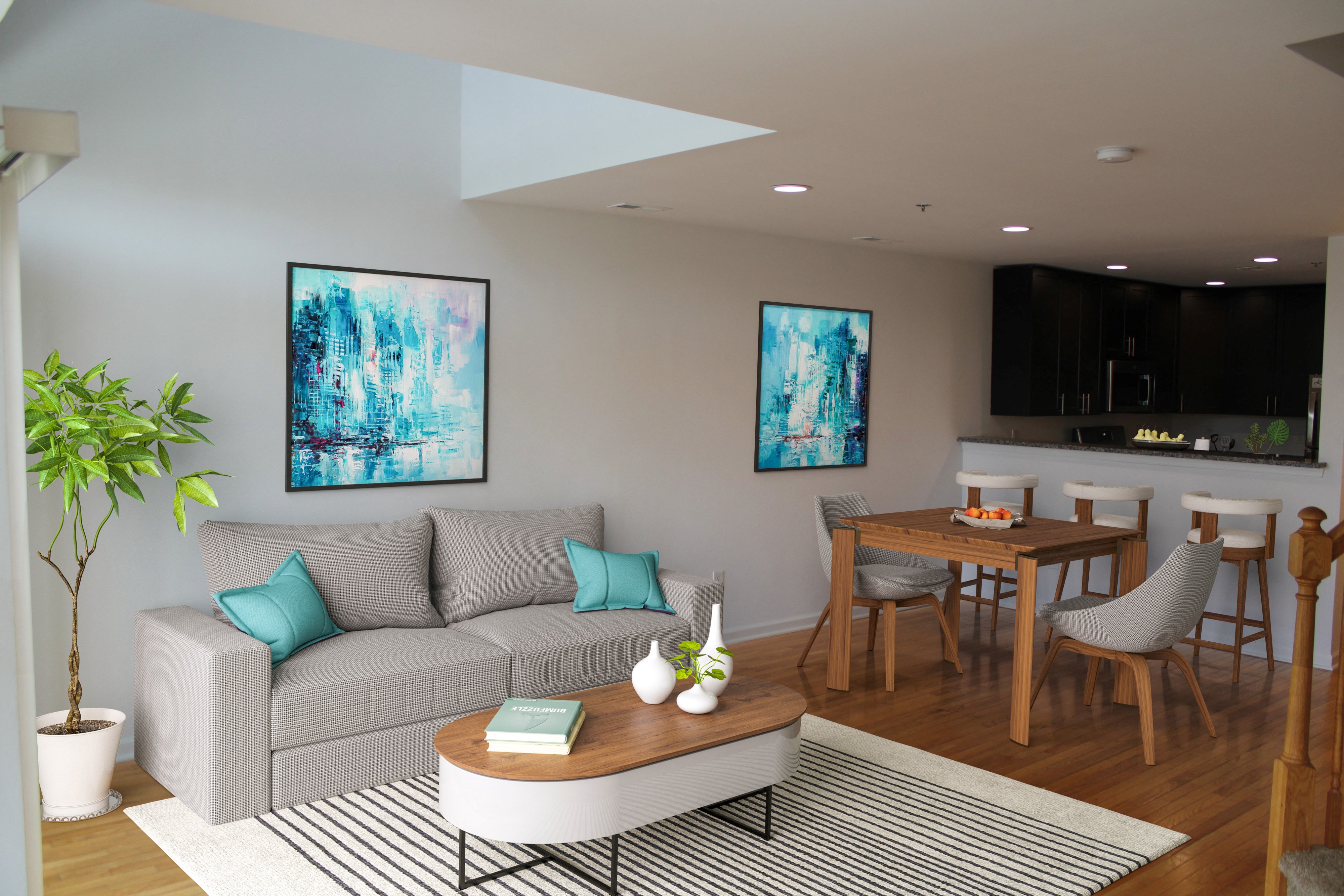 A living room with a grey couch and a coffee table.