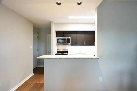 a kitchen with a counter top and a microwave