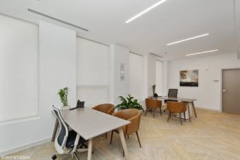 a room filled with furniture and a large window
