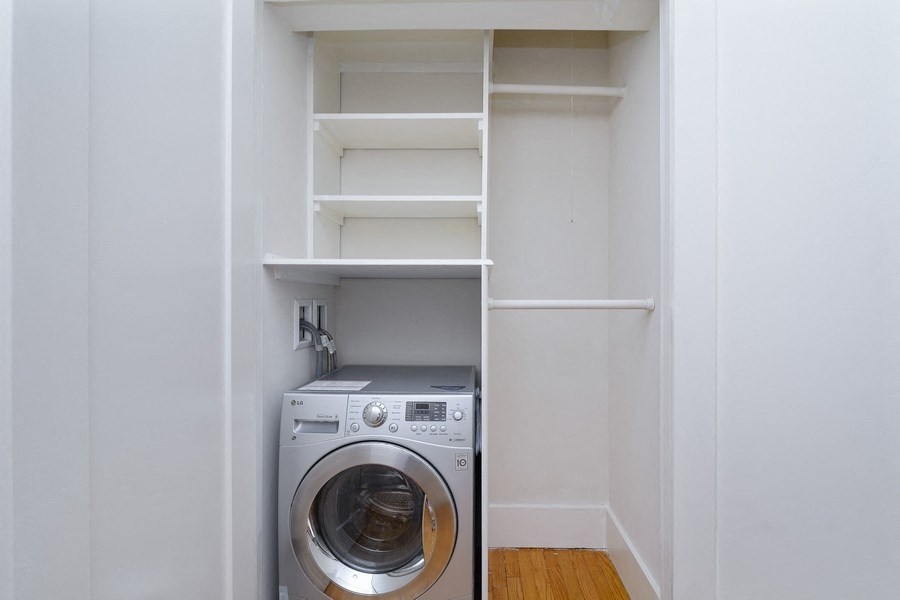 a small laundry room with a washer and dryer