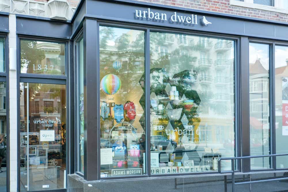 a store front with a bunch of items in the window