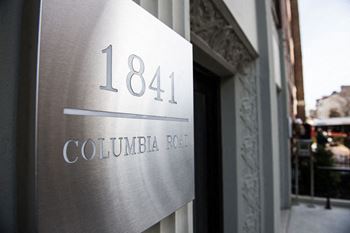 a building with a sign that reads 1841 columbia road