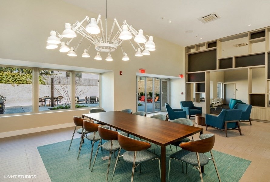 a conference room with a long table and chairs and a large window with a view at Carver and Slowe Apartments, Washington, Washington, DC 20001