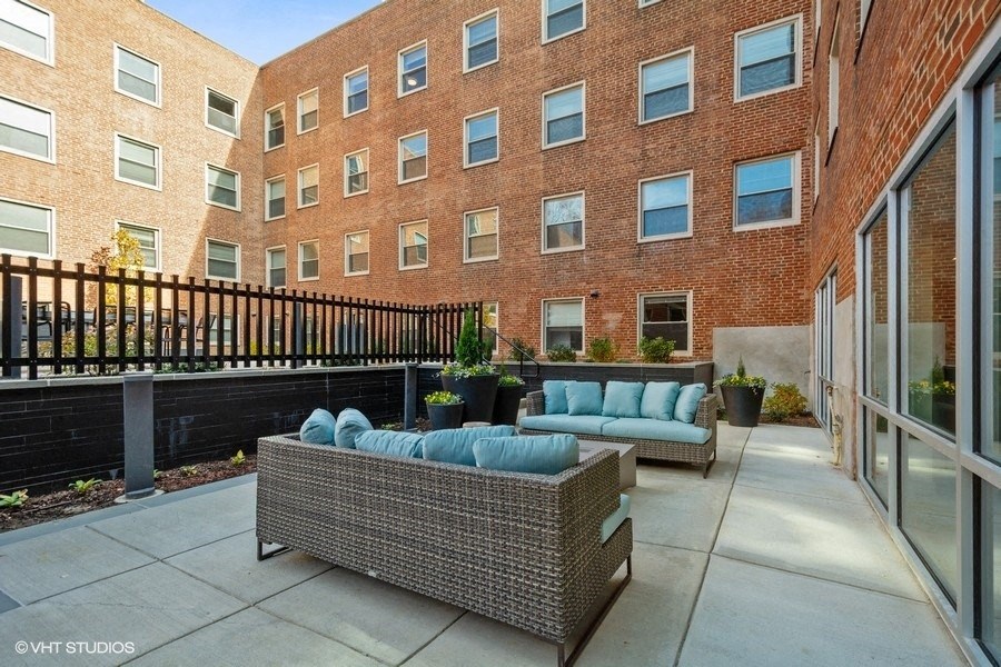 exterior view of courtyard and couches at Carver and Slowe Apartments, Washington Washington, DC