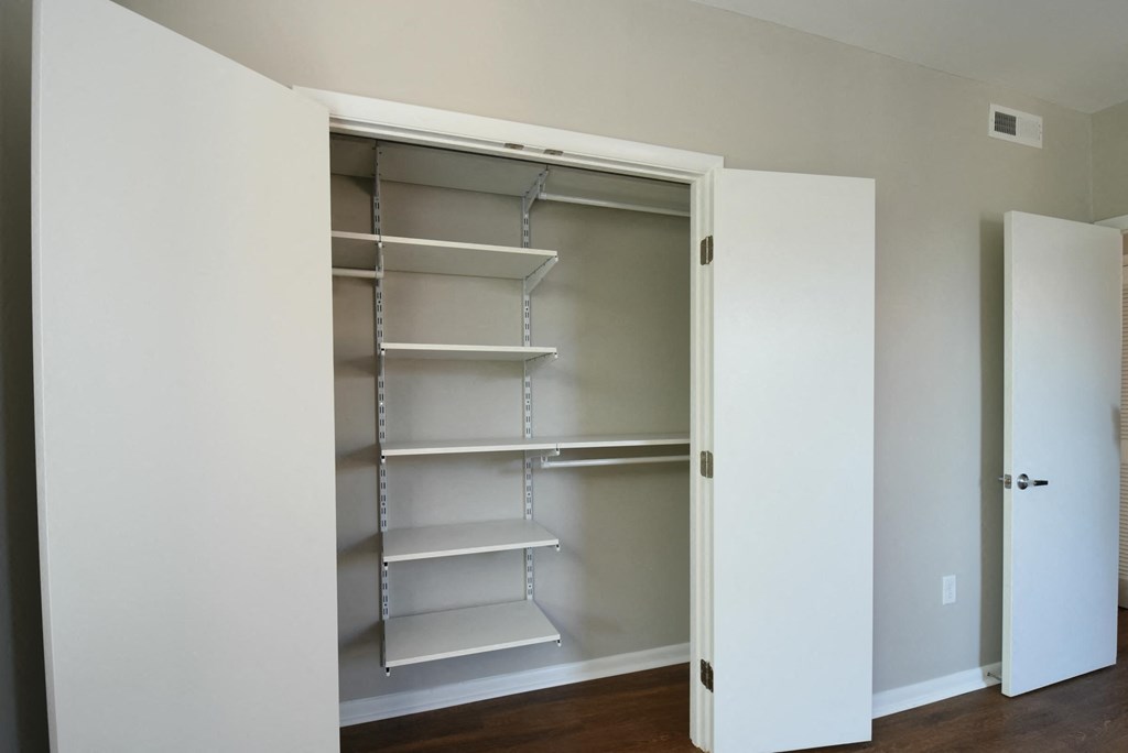a walk in closet in a 555 waverly unit
