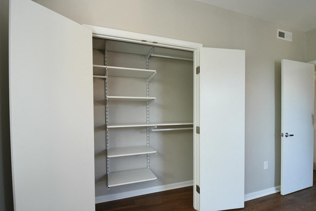a walk in closet in a 555 waverly unit