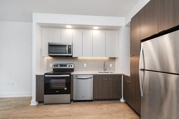 Modern Kitchen with Quartz Counters, Tiled Backsplash & Full Size Appliances - Photo Gallery 6