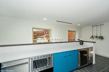 a kitchen with a counter top and a stove top oven