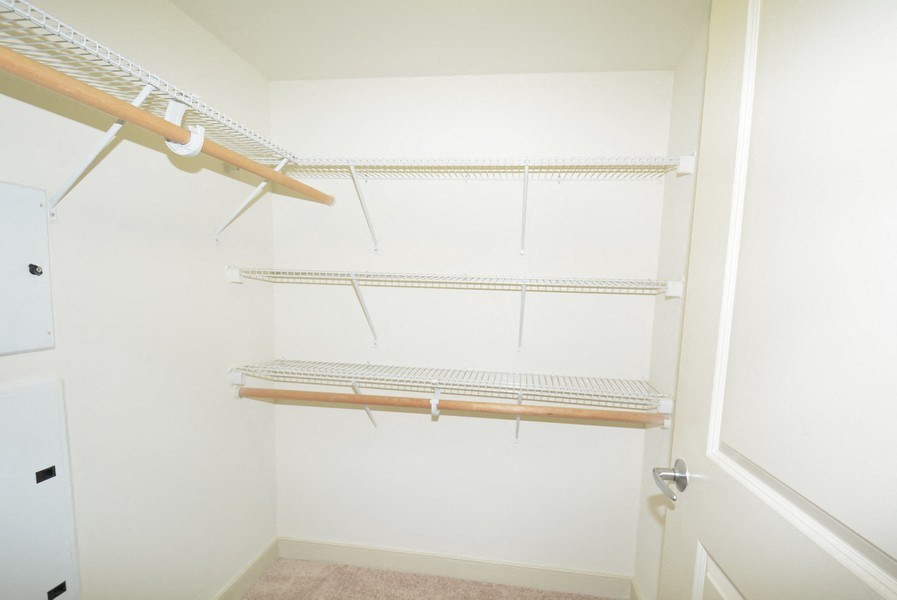 a walk in closet in a 555 waverly unit