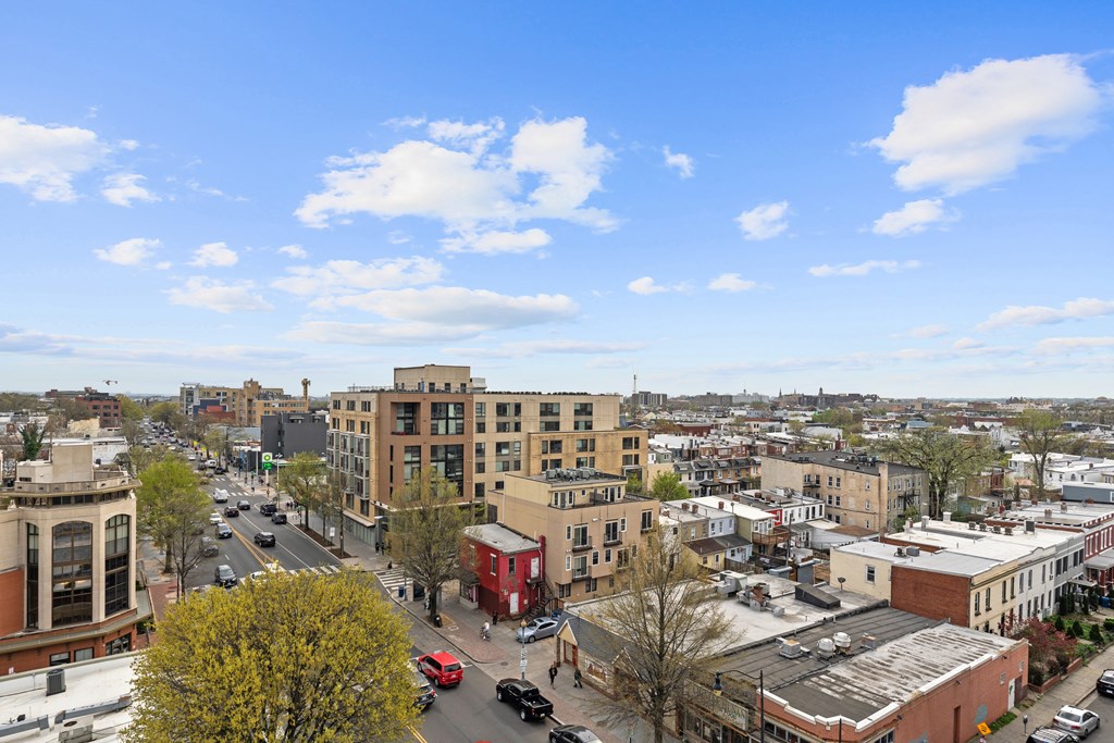A city street with cars and buildings.